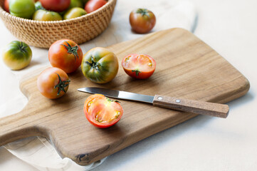 Warm sunshine under the indoor natural light, fresh daejeo tomatoes on wooden board