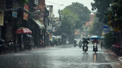 Fotobehang People with umbrellas on motorbikes in rainy street. © tiagozr
