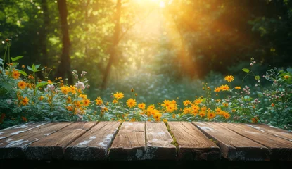 Foto op Plexiglas a wood table with yellow flowers in front of trees © Petru