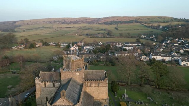 Aerial video of an old Cathedral in St Davids, Wales on a sunny day