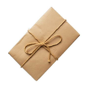 Cardboard shipping parcel in brown recycled wrapping paper, tied with brown string on a transparent background. Shipping, cargo and delivery concepts