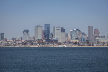 Fototapeta na wymiar Stunning aerial view of the Boston city skyline with Boston harbor in the foreground