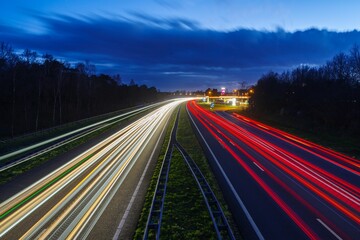 Long exposure to a busy road at night, illuminated by street lights