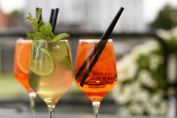 Alcoholic cocktail with straws. Bar