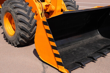 Tractor loader, yellow excavator, construction machinery, bucket equipment.