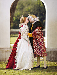 Medieval, king and couple kiss in marriage with renaissance fashion outdoor with marriage and love....
