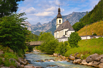 Fototapeta na wymiar Alpine church with mountain stream in Germany