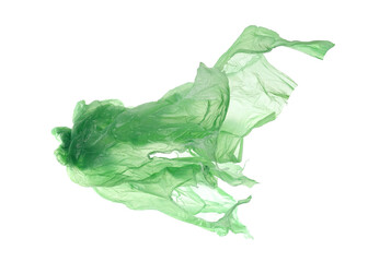Green crumpled nylon bag flying isolated on white, clipping path 
