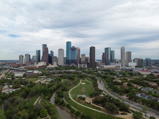 Fototapeta na wymiar Downtown Houston, Texas skyline with traffic in the background on a busy freeway