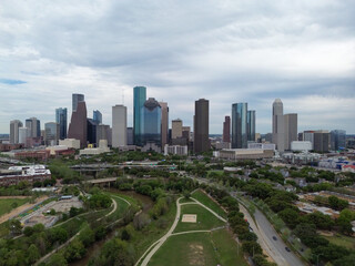 Naklejka na ściany i meble Downtown Houston, Texas skyline with traffic in the background on a busy freeway