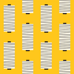 Retro vintage beige white dark gray sewing thread rolls on plain yellow