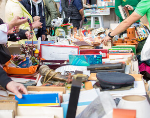 A person looking for some second hand old things in a flea market