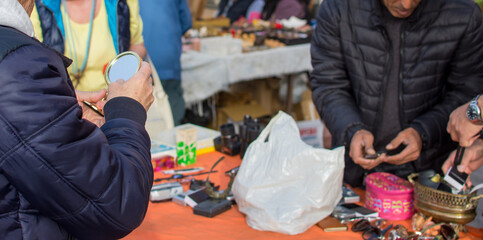 A person looking for some second hand old things in a flea market