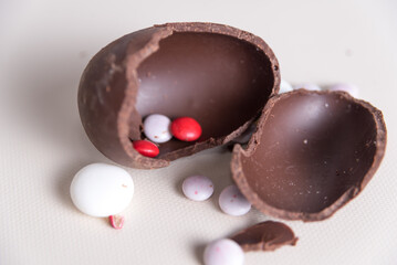 Sequence of a woman molding chocolate Easter eggs in her kitchen. melted chocolate, spice event, home, lifestyle concept