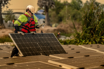 Photovoltaic engineers work on floating photovoltaics. workers Inspect and repair the solar panel equipment floating on water. Engineer working setup Floating solar panels Platform system on the lake.