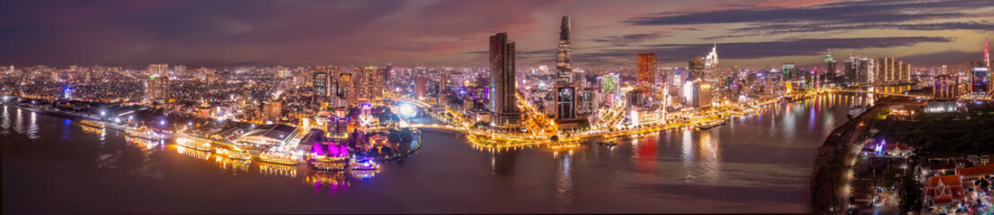 Aerial panoramic cityscape view of HoChiMinh city and the River Saigon, Vietnam with blue sky at...