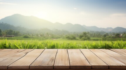 Empty wood table and blurred rice field 
