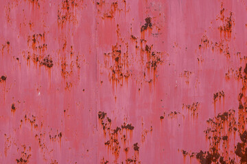 rusty red sun-bleached paint paint on flat sheet metal surface full-frame background and texture.