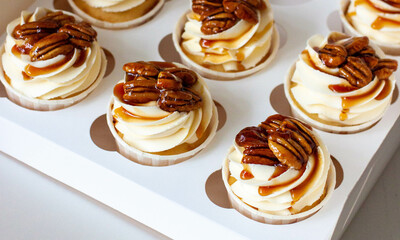 Pumpkin spice caramel pecan cupcakes with cream cheese frosting