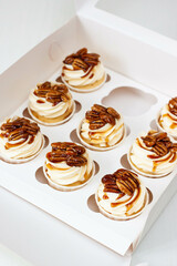 Pumpkin spice caramel pecan cupcakes with cream cheese frosting