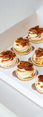 Pumpkin spice caramel pecan cupcakes with cream cheese frosting