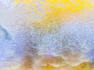 Bubbly, watery abstract background in blue and yellow