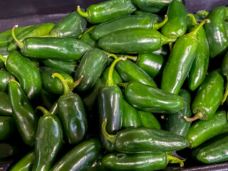 Jalapeño peppers piled together for sale
