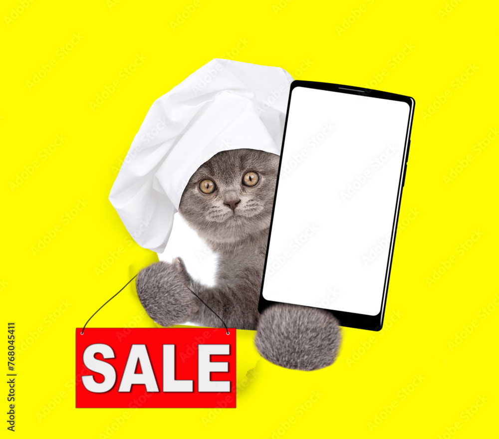 Aufkleber cat wearing chef's hat looking through the hole in yellow paper and shows signboard with labeled 