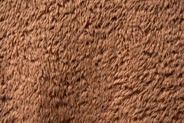 Texture of a brown faux fur as a background.