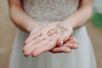 wedding rings in bride hands