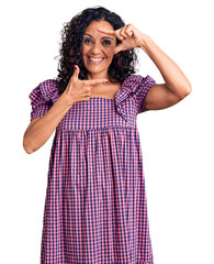 Middle age beautiful woman wearing casual dress smiling making frame with hands and fingers with happy face. creativity and photography concept.