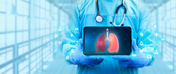 The doctor shows a digital image of the lungs on his tablet. Concept analysis and treatment of lung...