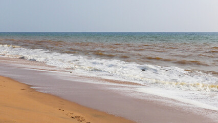 The foam of turbulent wave on the beach at Veli, Thiruvananthapuram, Kerala, India
