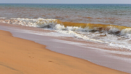 The foam of turbulent wave on the beach at Veli, Thiruvananthapuram, Kerala, India