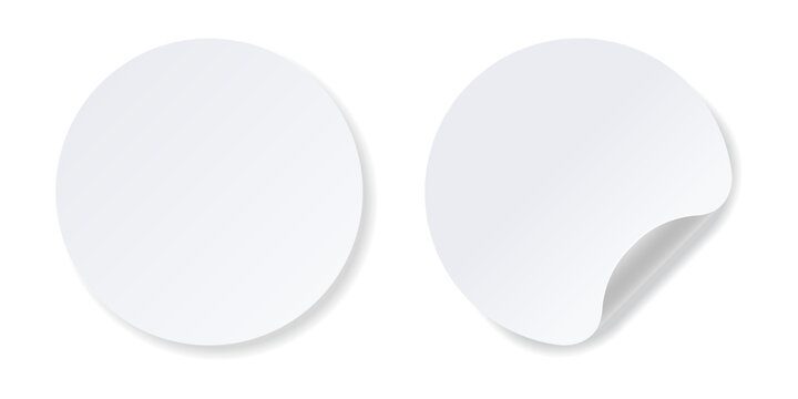Realistic white round stickers with folded corner.
