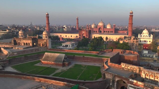  Badshahi Masjid in Lahore - The Emperor's Mosque, Pakistan Dome with Minarets. Aerial Drone Shot at sunrise time