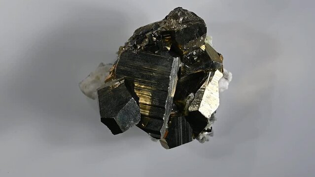 Iron Pyrite (fool's gold) cubic crystals and quartz rotating 