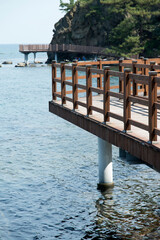 View of the seaside with the wooden footbridge