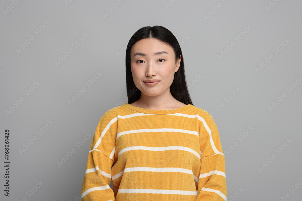 Canvas Prints Portrait of beautiful woman on grey background