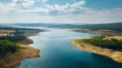 Fotobehang Receding Waters:The Visible Impacts of Climate Change on a Drying Lake Ecosystem © Mickey