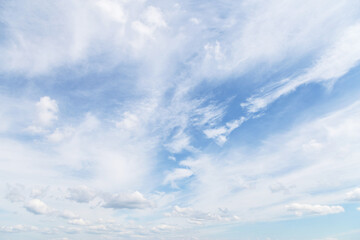 Beautiful soft gentle cloudy blue sky with white cirrus clouds, abstract background texture