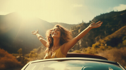 Happy young woman in the cabriolet car on a sunny day