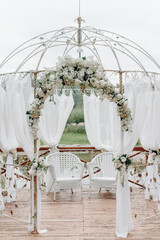 white metal arch for newlyweds