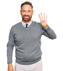 Fototapeta premium Handsome middle age man wearing business clothes showing and pointing up with fingers number four while smiling confident and happy.