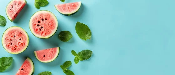 Foto op Plexiglas  Watermelon slices with mint on blue background for text or image © Jevjenijs