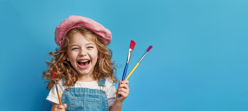 cute kid holding paint brush on blue color background, generative ai
