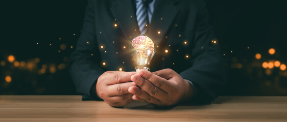 Innovative Businessman with Brain Illuminates Ideas Holding Light Bulb, Conceptual Creativity....