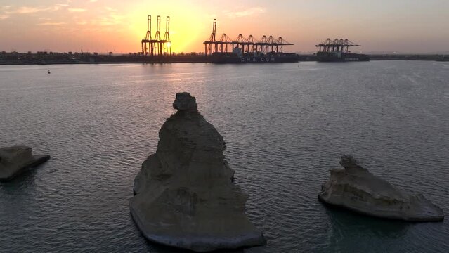 Huge Port of Karachi at sunset time. Cargo Ship Docked at KPT Karachi, Aerial Drone Shot