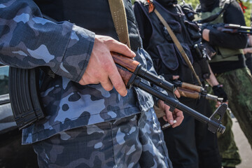 Militia members in front of Administration building occupied by supporters of DPR during Russo-Ukrainian War, Ukraine