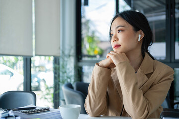 Woman listening to music while working.